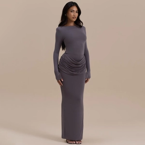 Detail of waist ruching and side slit on this slim fit dark grey long sleeve maxi dress