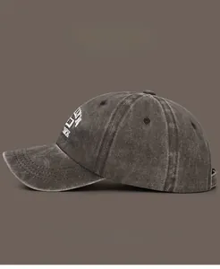Detail view of washed vintage cotton baseball cap with 3D embroidery and side color swatches