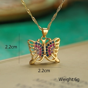 Macro detail of gold butterfly pendant with colorful zircon stones and 2.2cm size specs