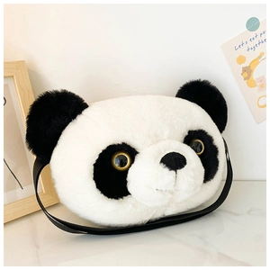 Close-up of a plush panda head bag with black straps on a white marble surface