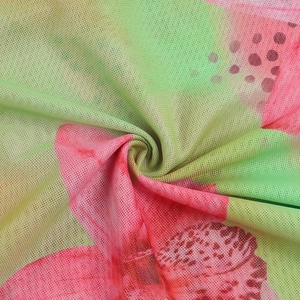 Close-up of pink floral mesh fabric detail with premium texture and drape