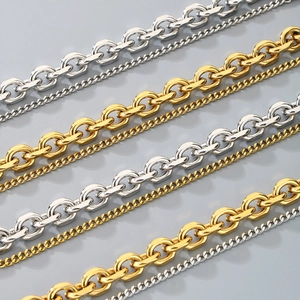Detail of silver and gold stainless steel curb chains in various widths with OT buckle