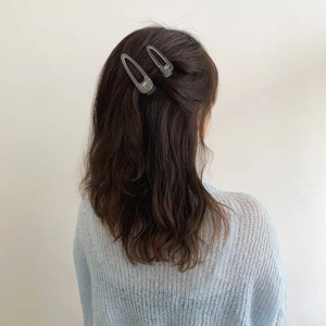 Set of two transparent grey hair clips in water drop shape for minimalist styling