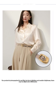 Detail of slim beige leather belt for women with antique gold square metal buckle