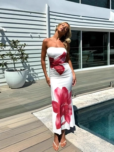 Sleeveless white bodycon maxi dress with large red floral prints and side slit