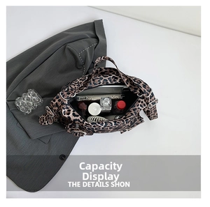 Spacious interior of leopard print tote bag holding phone and cosmetics