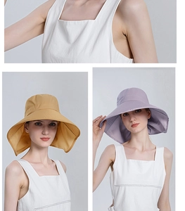 Detail of wide brim sun hat with neck protection in ginger and light purple colors