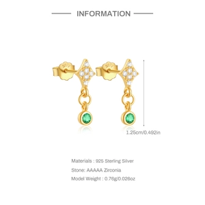 Detail of gold heart earrings with green stone and 925 silver stamp showing dimensions
