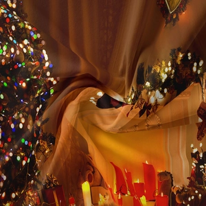 Close-up of soft Christmas tapestry fabric with golden ribbons and festive trees