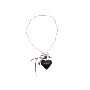 Y2K leather heart pendant necklace with black bow and bead chain on white background