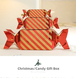 Three-piece red and gold striped candy-shaped Christmas gift boxes with glitter finish