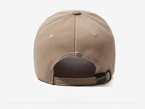 Detail view of khaki baseball cap back showing adjustable metal buckle and fabric texture