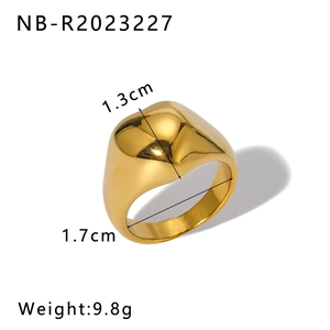 Macro shot of 18K gold plated heart ring showing dimensions 1.7cm diameter and 1.3cm width