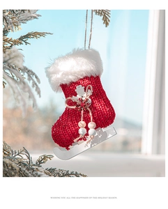 Red knit skate-shaped Christmas stocking ornament with faux fur trim and white snowflakes