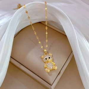 Luxurious gold-plated teddy bear pendant necklace with sparkling crystals in a gift box