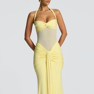 Close-up of a yellow halter neck dress featuring ruched draping and a slim fit cut