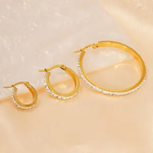 Set of three sizes gold plated titanium steel hoop earrings with sparkling cubic zirconia