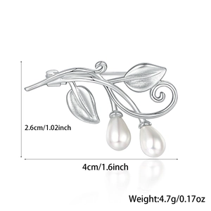 Detailed view of silver leaf brooch with pearls showing 4.0cm width and 2.6cm height