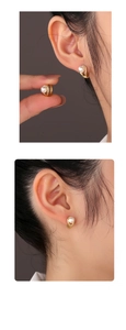 Detail view of 14K gold-plated S925 silver earrings with elegant white pearls