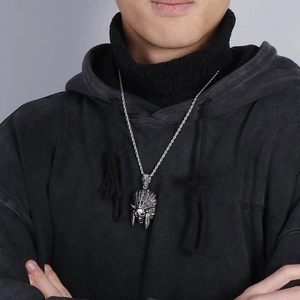 Close-up of men's stainless steel Indian chief skull pendant with silver rope chain
