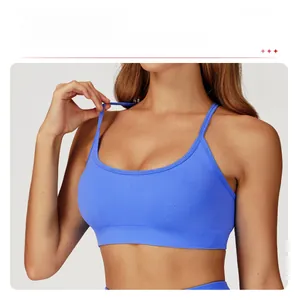 Detail of blue seamless sports bra featuring thin straps and removable pads for yoga