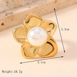 Minimalist gold stainless steel ring with flower design and central white pearl accent