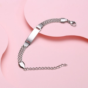 Macro view of mesh stainless steel ID bracelet featuring a customizable blank nameplate