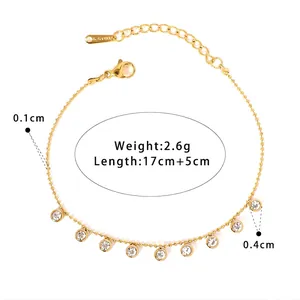 Bracelet chaîne à billes en acier doré orné de breloques rondes brillantes et fermoir