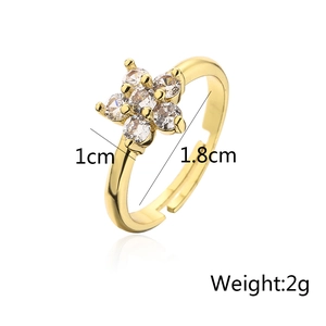 Macro view of 18K gold plated flower ring showing 1cm diameter and 1.8cm inner band width