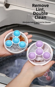 Detailed view of blue and purple floating laundry lint mesh bag filters in a washer