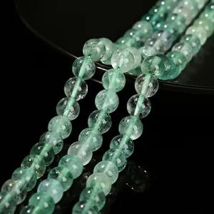 Natural green fluorite round beads for DIY jewelry making in semi-transparent light green
