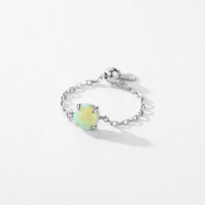925 silver opal chain ring with adjustable toggle and round charm on white background