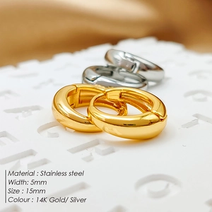 Detailed view of 5mm wide stainless steel hoop earrings in gold and silver finish