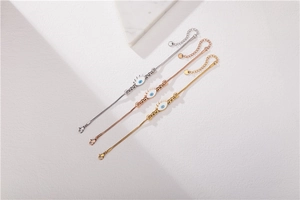 Detailed view of evil eye beaded bracelets in silver, gold, and rose gold finishes