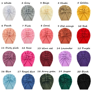 Grid view of soft cotton baby beanies in 20 assorted colors with bow decoration