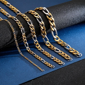 Detail of two-tone gold and silver Figaro chains in various widths and thicknesses
