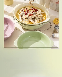 Deep ceramic soup bowl with wavy petal edges and handles in a creamy pastel finish
