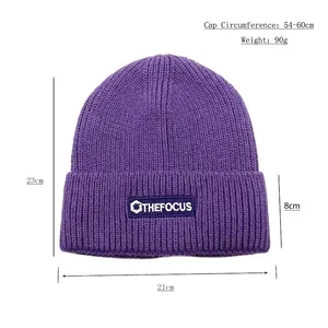Purple knit beanie with THE FOCUS patch showing dimensions 21x23cm and 8cm cuff