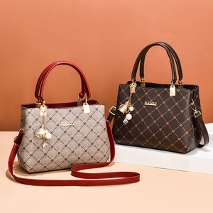 Large capacity leather handbag for women featuring checkered pattern and pearl pendant