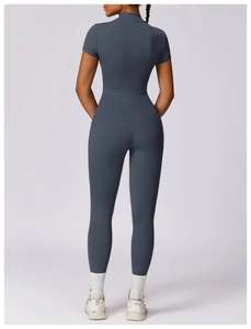 Detail view of the back silhouette and high-stretch fabric of the charcoal yoga bodysuit