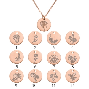 Detail showing 12 monthly birth flower engravings on rose gold round pendant necklaces