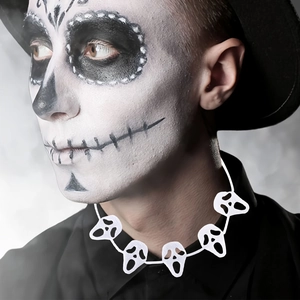Detailed view of adjustable Halloween skeleton necklace worn on a themed model