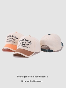 Detailed view of color-block kids baseball caps with California embroidery and adjustable strap
