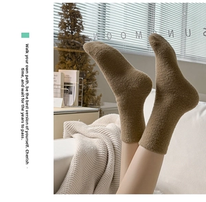 Close-up of warm brown plush thermal crew socks with soft fleece texture for winter