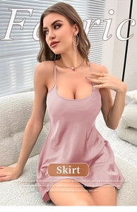 Detail of dusty pink satin silk nightgown featuring delicate spaghetti straps and smooth fabric