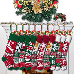 Detail of assorted knitted Christmas stockings with reindeer and snowflake embroidery