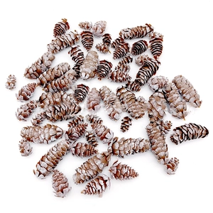 Close-up of artificial snow-tipped pine cones for creative DIY Christmas decorations