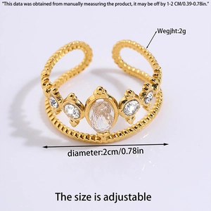 Detailed view of adjustable golden crown ring featuring clear cubic zirconia and beaded band