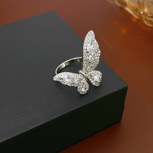Detailed macro view of silver butterfly ring featuring white marquise zircon stones