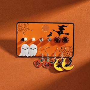 Detail of Halloween earring set with ghost, pumpkin, and bat designs on display card